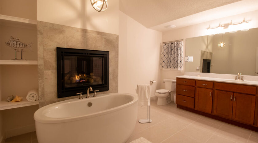 Soaker tub by fireplace